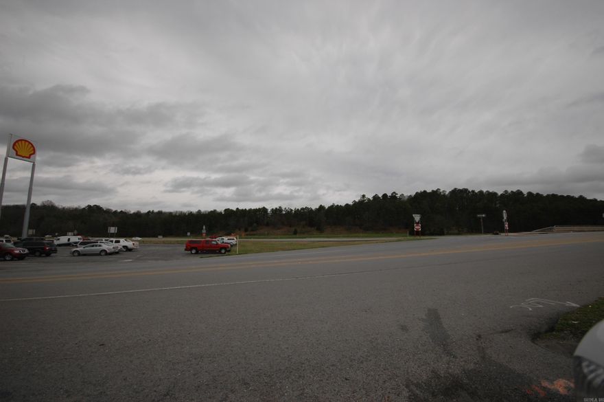 This property includes 3 parcels, 2 parcels facing Crystal Hill Rd are in city limits of NLR, large tract app 14 acres is in the County.  This is a high visibility property off I40 and sizable traffic count. Rentable trailer off Standridge included.  Property at one time was a travel center building torn down in 2023 but back canopy was left for possible future use.