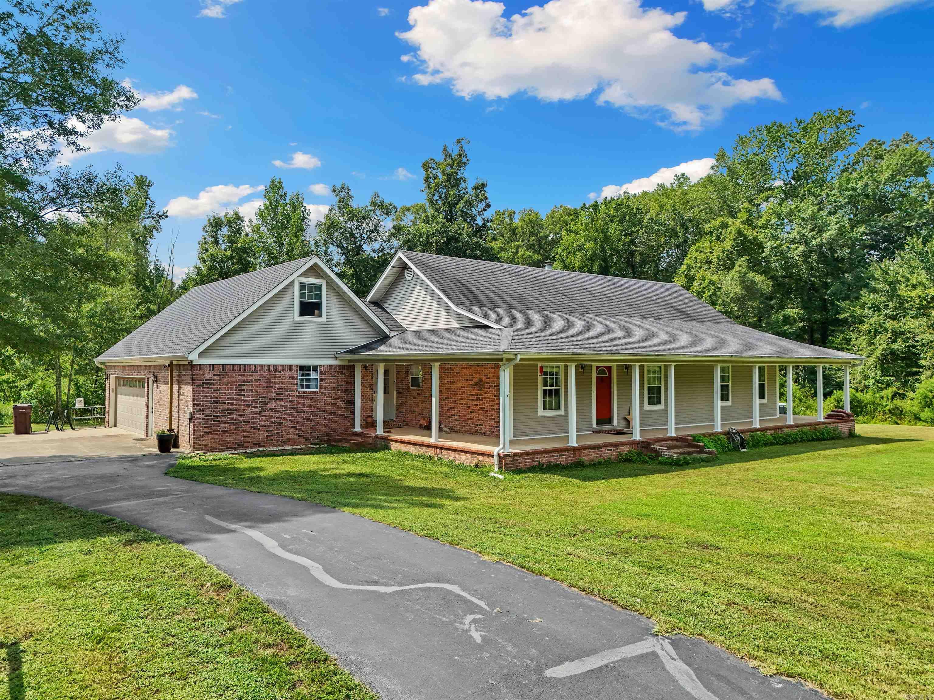 Discover the perfect blend of country living and modern convenience in this beautiful, spacious home. Nestled on 4.77 acres of lush land, this property is ideal for those seeking a tranquil lifestyle without sacrificing proximity to the city. This home provides ample space for family and guests, ensuring comfort and privacy for everyone. Enjoy the beauty of every season from the comfort of the bright and airy sunroom. The laundry room with half bath is added convenience and functionality for busy households. Upstairs leads to the attic/ bonus room, could potentially offer additional living space, ideal for a home office, playroom, or guest suite. Attic is plumbed for an additional bathroom, potential for further customization and expansion. New roof (2017), HVAC system (6 years old), updated crawl space, new septic (2015). Outside, you will find a large shop with bathroom, perfect for hobbies, projects or a home business. An old barn near the shop can be used for livestock, storing equipment or extra storage. This home offers a unique opportunity to enjoy the best of both worlds. Don't miss your chance to make this property your own!
