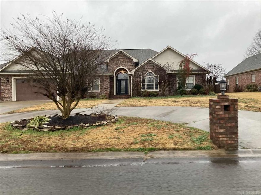 Gorgeous brick home with ALL the amenities! 3 bedrooms with office/optional 4th bedroom and 2.5 bathrooms. High ceilings, fireplace, hard flooring throughout, separate dining room, plenty of windows, circle drive and 3 car garage. The fully fenced backyard has a large covered deck with built-in seating, plenty of yard to play and even a basketball half-court! All of this in a beautiful subdivision within walking distance to Cabot Middle School North.  *Active Military Discount Available*