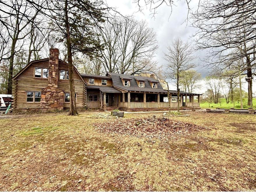 Nestled in the serene, wooded landscape of Arkansas, this extraordinary 29 acre home offers unparalleled seclusion and luxury, crowned by its private airstrip. This rare feature allows aviation enthusiasts to arrive directly at the doorstep.   The home itself is a stunning beautifully crafted log home spanning approximately 4500 square feet of warmth with several inviting living spaces. This residence boasts a massive screened in porch, 6 spacious bedrooms, 4 full baths, 1 half bath and 2 built-in natural stone fireplaces with a game room, basement and several other amenities for everyone to love and is a short drive to the beautiful Cossatot River State Park.   This property is designed with rustic elegance and modern comfort in mind either as a primary residence, country home, weekend escape or a one of a kind retreat that is ready to meet any of your needs.   This property includes seller updates like new flooring, new windows, a new roof and a brand new garage.
