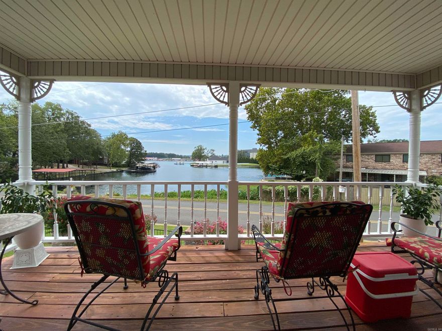 Lake & Mountain View Property! Tasteful 2 bedroom 2.5 bath but stubbed out and prepped for an 3rd suite. Garden/townhome in style with small POA fee that covers the grounds. Ample storage inside and out. All main living amenities are ground level, 2 beds/2 baths second floor and bonus space for third suite 600sqf+/- on third floor. 1st & 2nd floor with lakeside balconies perfect for morning coffee or watching annual firework display. Awesome 7 South location near shopping, dining and all things Hot Springs. Pride of ownership shows in this quaint neighborhood. This particular home is situated with the Best lake view so don't miss the opportunity!