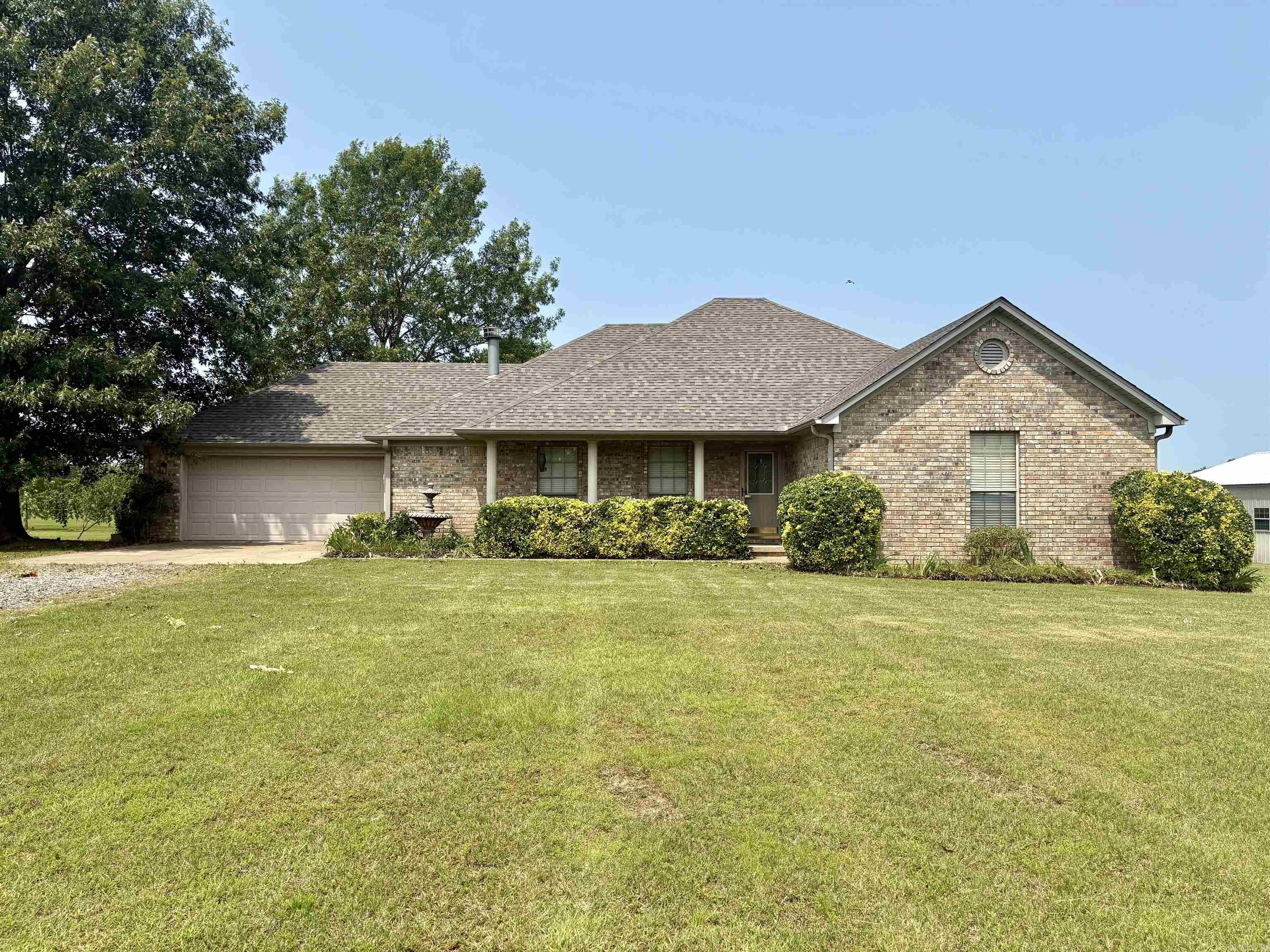 Nestled in a sought-after subdivision, this charming 3-bedroom, 2 bath home sits on a sprawling 3.33 acre lot. The property features a fenced in backyard area, perfect for outdoor activities and privacy. A standout feature is the 30x40 outdoor shop, ideal for hobbies or extra storage. Inside you will find a home that has been recently updated with fresh interior paint throughout and laminate flooring-no carpet! There is a convenient pantry just off the laundry room. AGENTS SEE REMARKS!!