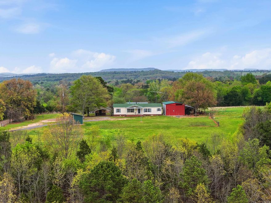 Welcome to 158 Heart Drive in Springfield, Arkansas! This stunning 39-acre property offers the perfect blend of open pasture and wooded land, creating endless possibilities for recreation, livestock, or building your dream rural lifestyle. The property is fully fenced and features a beautiful pond, breathtaking views, and plenty of space to roam and enjoy the outdoors. A 2002 mobile home sits on the property, providing comfortable living or a great starting point while you plan future improvements. Additional features include a shop for storage or projects and a storm shelter for added peace of mind. Mineral rights convey, making this property an even more valuable investment. If you’ve been searching for acreage with privacy, functionality, and scenic surroundings, you don’t want to miss this one. Give us a call today to schedule your private showing!