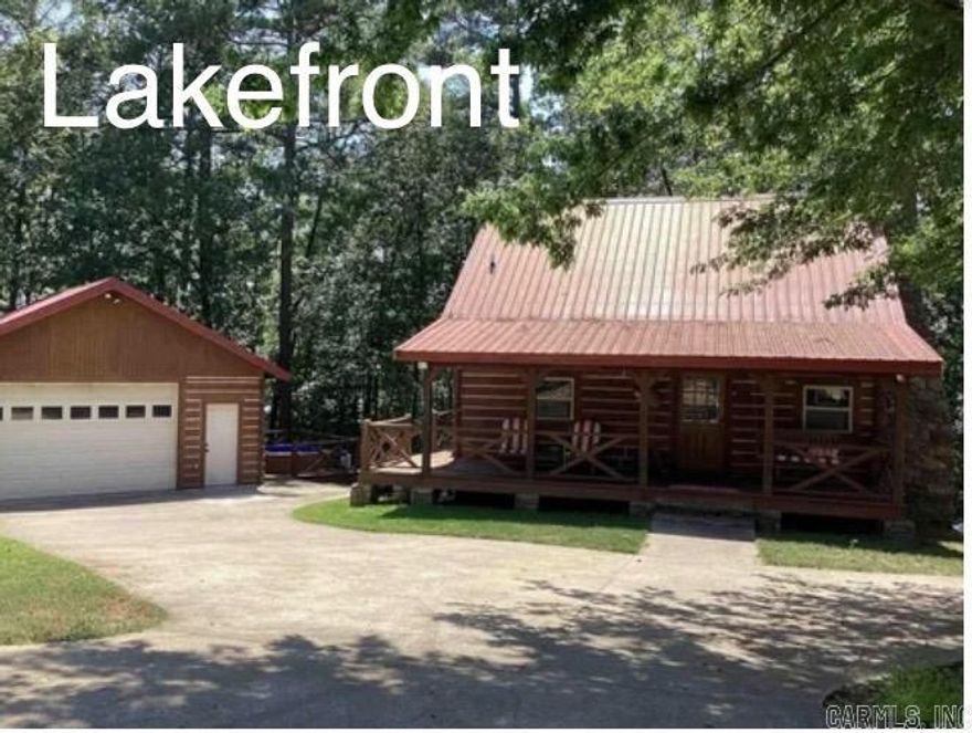 LAKEFRONT ON THE NARROWS!  Fantastic Real Log Cabin with 24x24 air conditioned log garage. What a package deal, fully furnished dishes and all. This has the real lake feel when you walk into the main floor featuring vaulted wood ceilings with open Kitchen, dining, living room with floor to ceiling rock, wood burning fireplace with a sunset made in above the mantle. Main level has large covered deck with lake view. Upstairs Bedroom with king size bed and full bath with beautiful lake view through upper windows. Downstairs offers 2 more bedrooms with Jack and Jill bath and each bedroom has its own vanity. Walk out of basement to covered patio and path to the water.  Great place to watch the sunset and relax!!  Only 1/2 mile to town and the Lacy’s Marina. Call for showing! 870-307-1106