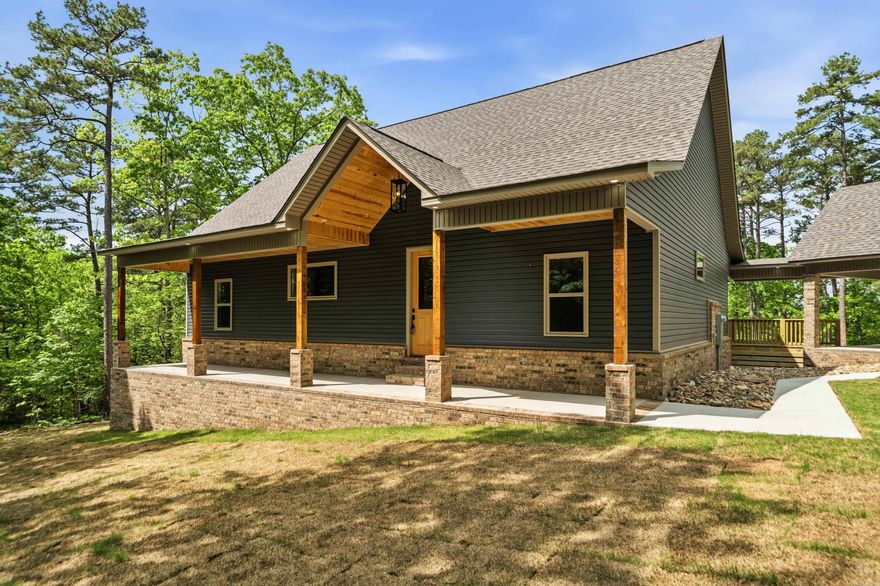 New Construction, 3-bedroom 2 bath lake home on 4 acres on Lake Hamilton. Gourmet kitchen with gas stove and modern fixtures. 2-bay carport with an attached breezeway. Cafe appliances in the kitchen. This home is surrounded by nature and will be the perfect place for entertaining with spacious porches and 200 ft of lake frontage.