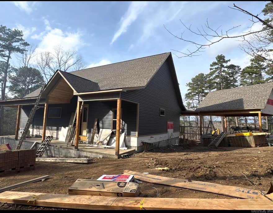 New Construction, 3-bedroom 2 bath lake home on 4 acres on Lake Hamilton. Gourmet kitchen with gas stove and modern fixtures. 2-bay carport with an attached breezeway. This home is surrounded by nature and will be the perfect place for entertaining with spacious porches and 200 ft of lake frontage. Will update pictures throughout construction.