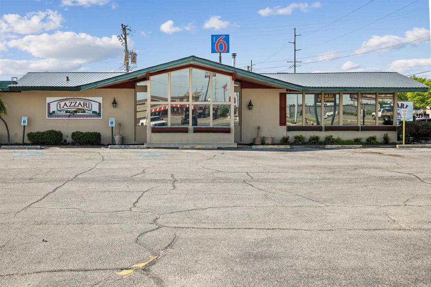 Presenting a premier investment or owner/operator opportunity in the heart of Jonesboro’s thriving retail and dining corridor. Located at 2230 S. Caraway Road, this offering features a 6,661 square foot commercial food service facility situated on approximately 1.14 acres with approximately 200 feet of frontage and 250 feet of depth. The property is positioned in one of Jonesboro’s most desirable commercial locations, offering exceptional visibility, high traffic counts, and strong surrounding demographics. The building is currently tenant-occupied by a longstanding and successful restaurant, Lazzari’s Italian Oven; however, the offering is for real estate only and does not include the business.  Site improvements include approximately 21,952 square feet of asphalt paving, 676 square feet of concrete pads, porches, and walkways, as well as sodium vapor security lighting, monument signage, and established landscaping. The interior layout includes an estimated seating capacity for approximately 200 patrons, based on the current setup of 50 tables with four-chair seating, along with a full-service bar area, reception and waiting area, commercial kitchen, restrooms, and office space.