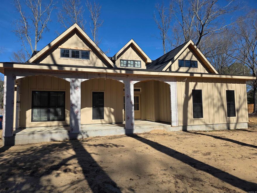 Introducing The Panache— a 2,861 sq. ft. MASTERPIECE tucked within Conway’s prestigious Friendship Corner. Blending architectural elegance with modern comfort, this custom 3-bedroom, 2.5-bath home was designed for those who appreciate both style and substance. Soaring ceilings, sleek lines, and refined finishes set the tone from the moment you step inside. The chef’s kitchen features high-end appliances, quartz countertops, and an expansive island that flows seamlessly into the open-concept living area—perfect for entertaining or relaxing in quiet luxury.  The spa-inspired primary suite is a retreat of its own, complete with a deep soaking tub, walk-in shower, and dual vanities surrounded by serene design. A heated and cooled four-seasons room offers a year-round haven for morning coffee, afternoon reading, or evening sunsets.  Located just minutes from Beaver Fork Lake and with quick access to the interstate, The Panache offers the perfect blend of tranquility and convenience. Sophisticated, functional, and beautifully crafted—this is modern living at its most graceful.  *Four seasons room has been added to the square footage. See associated docs for more finishes, plans, etc.!