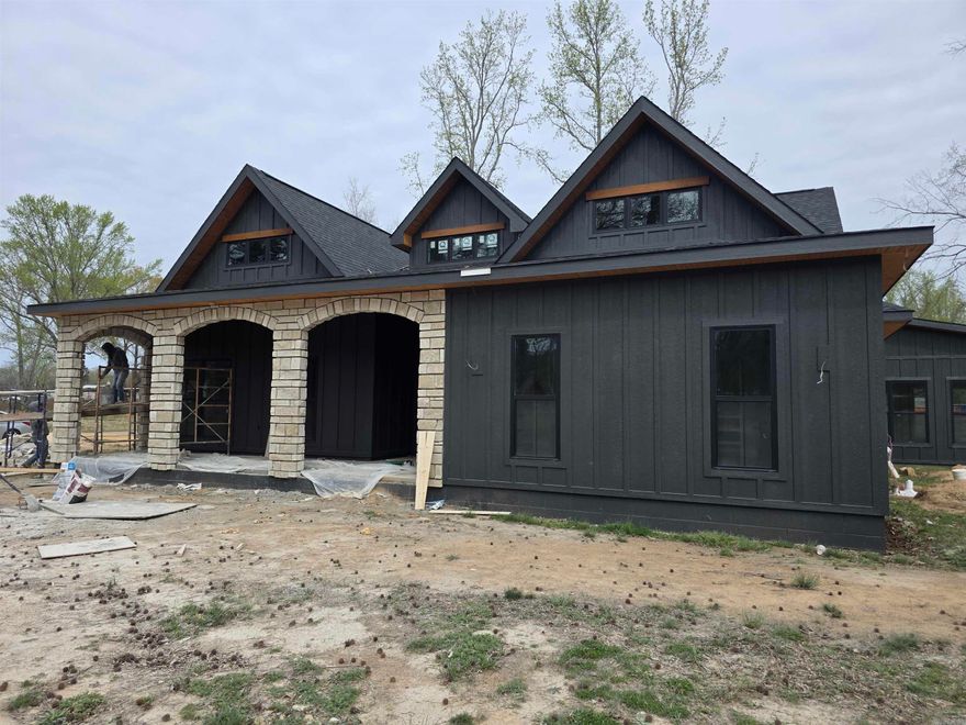 Introducing The Panache— a 2,861 sq. ft. MASTERPIECE tucked within Conway’s prestigious Friendship Corner. Blending architectural elegance with modern comfort, this custom 3-bedroom, 2.5-bath home was designed for those who appreciate both style and substance. Soaring ceilings, sleek lines, and refined finishes set the tone from the moment you step inside. The chef’s kitchen features high-end appliances, quartz countertops, and an expansive island that flows seamlessly into the open-concept living area—perfect for entertaining or relaxing in quiet luxury.  The spa-inspired primary suite is a retreat of its own, complete with a deep soaking tub, walk-in shower, and dual vanities surrounded by serene design. A heated and cooled four-seasons room offers a year-round haven for morning coffee, afternoon reading, or evening sunsets.  Located just minutes from Beaver Fork Lake and with quick access to the interstate, The Panache offers the perfect blend of tranquility and convenience. Sophisticated, functional, and beautifully crafted—this is modern living at its most graceful.  *Four seasons room has been added to the square footage. See associated docs for more finishes, plans, etc.!