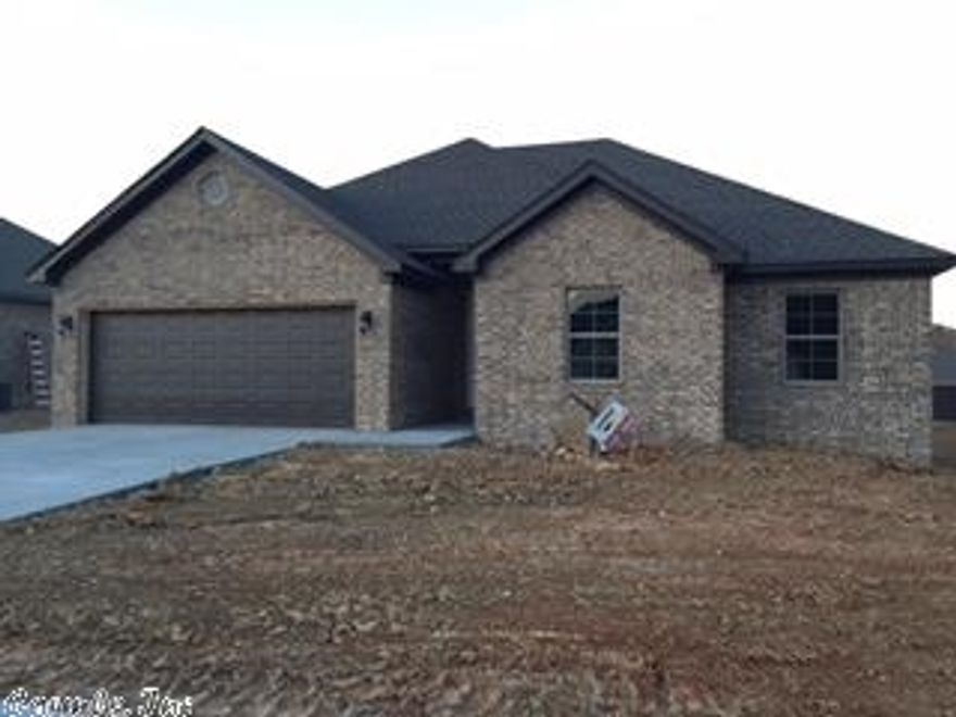 100% brick home, open floor plan, crown molding, huge island in kitchen, granite counter tops throughout, handscraped wood laminate flooring in all main areas. Large custom tile shower in master bathroom, covered back porch.  RD eligible area!