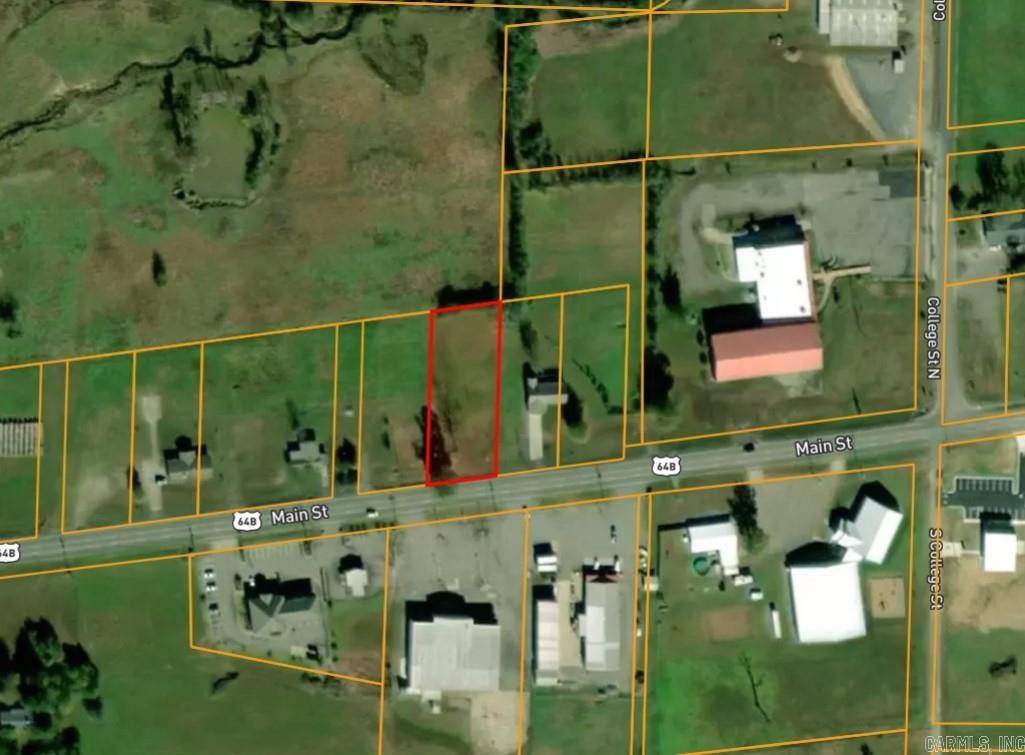 Excellent opportunity to build residential or commercial on this centrally located lot in Vilonia. Property features utilities on site (water, electric) plus an existing storm cellar and paved driveway for added convenience. Zoned C-1 and residential, allowing for a wide range of development options. Located on Main Street with great visibility and access. Ready for your next home, business, or investment project!