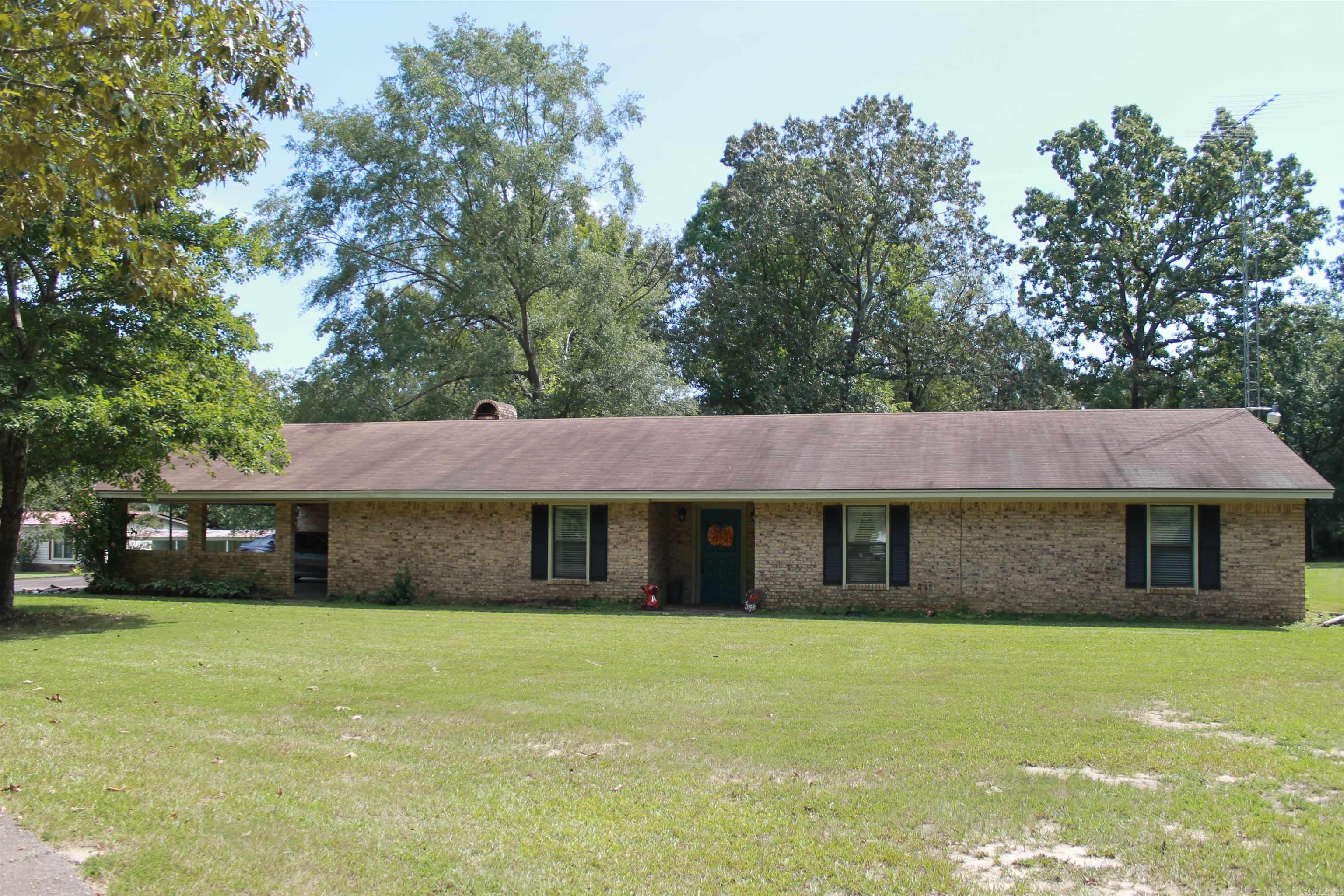 House is in country with acreage and a pond.