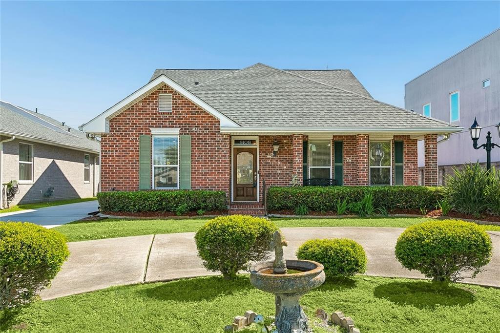 Great Curb appeal with lush garden and long drivew