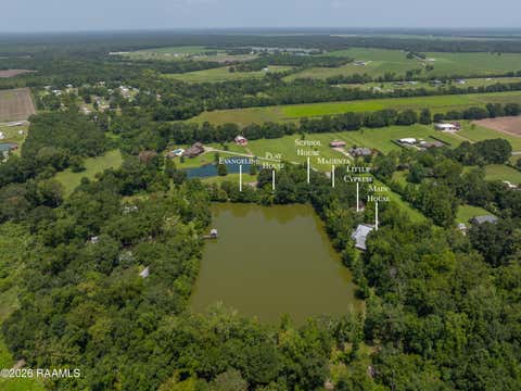 Photo of 1138 Lawless Tauzin Road, Breaux Bridge, LA 70517 (MLS # 2600007100)
