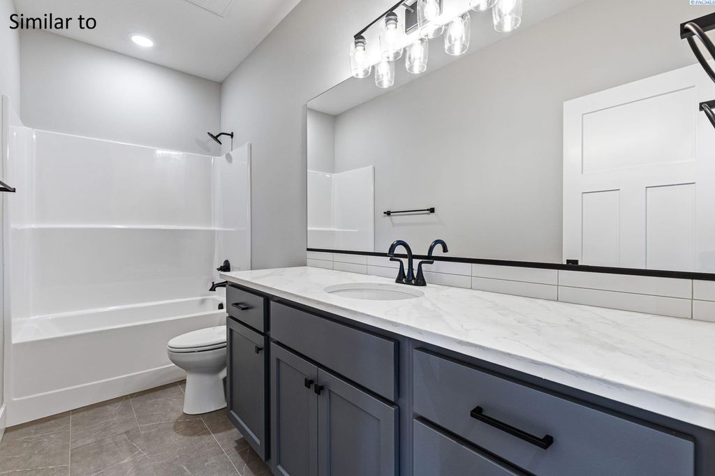 Photo of 987 Miraflores Ave, West Richland, WA 99353 (MLS # 289544)