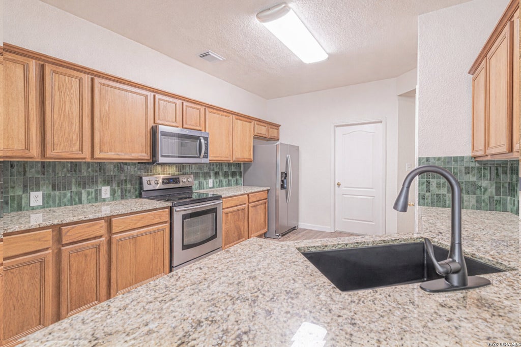 Photo of 213 TAPWOOD LN, Cibolo, TX 78108 (MLS # 2003476)