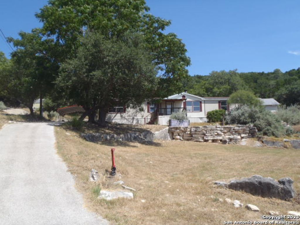 Photo of 410 Duck Mountain Ln, Canyon Lake, TX 78133 (MLS # 1907529)