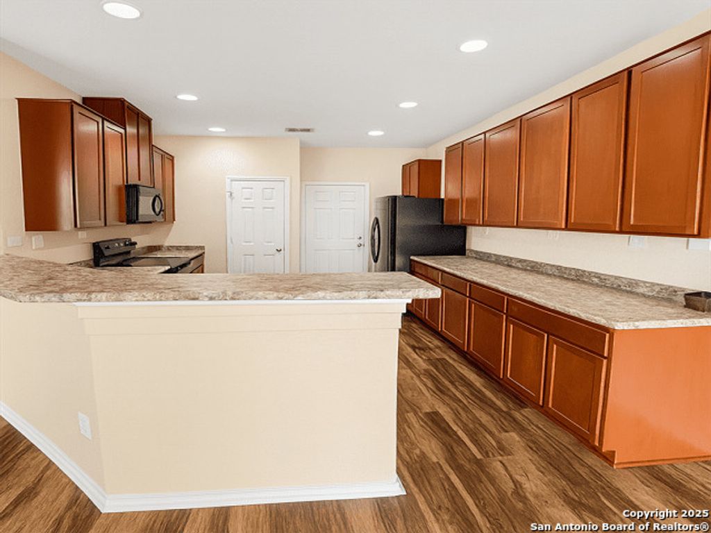 Photo of 9838 Twinbear Creek, San Antonio, TX 78245 (MLS # 1914436)