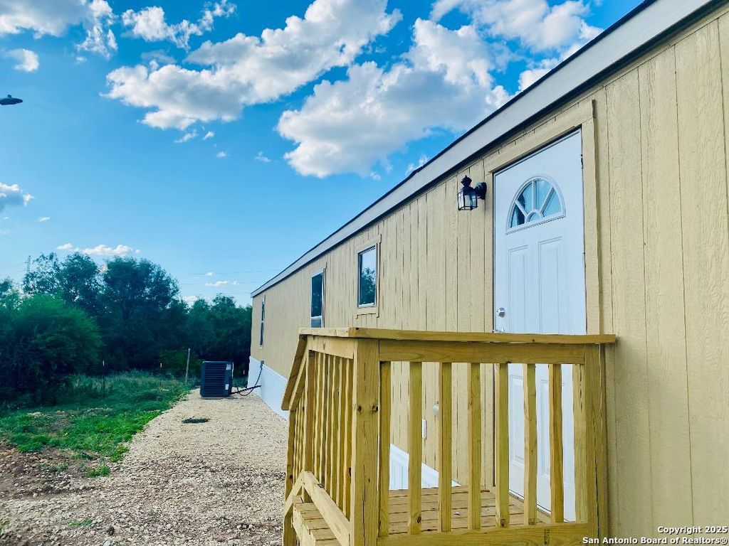 Photo of 698 Forest Creek, Devine, TX 78016 (MLS # 1909841)