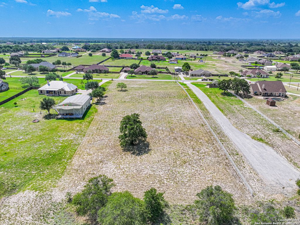 Photo of 213 ABREGO LAKE DR, Floresville, TX 78114 (MLS # 1747202)