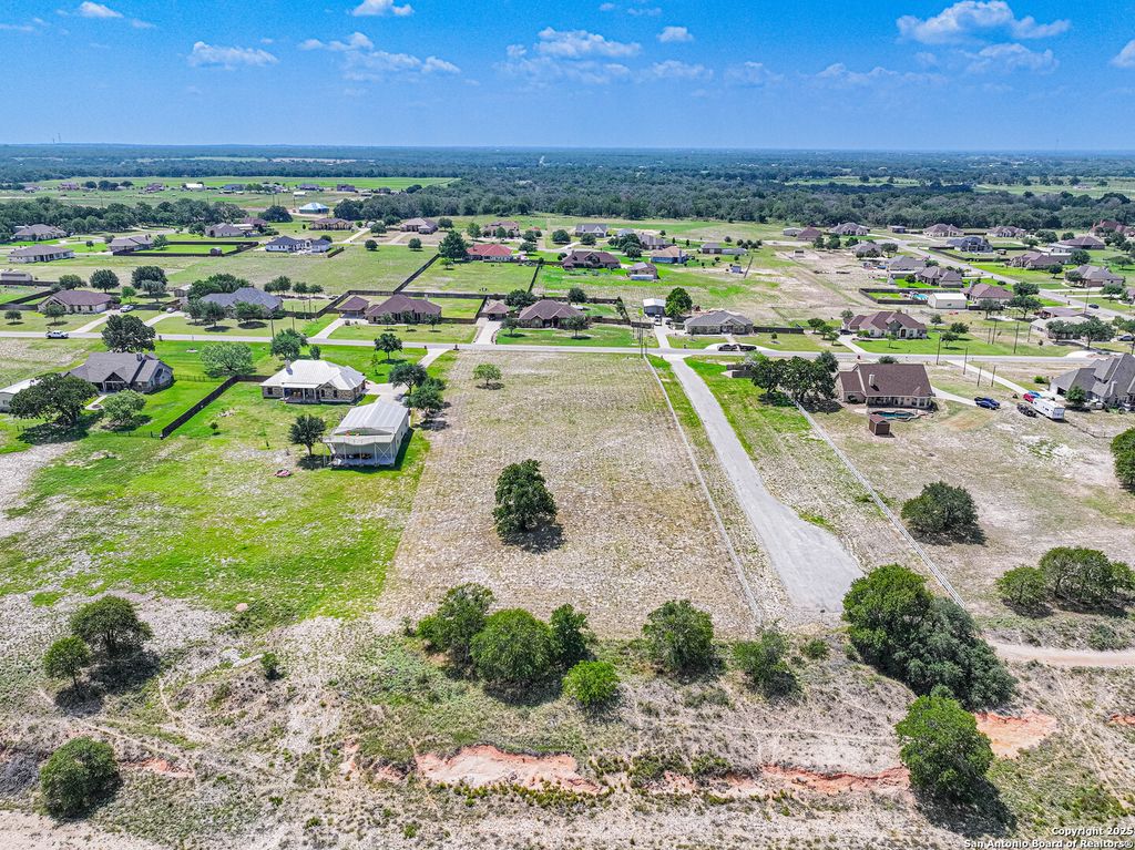 Photo of 213 ABREGO LAKE DR, Floresville, TX 78114 (MLS # 1747202)