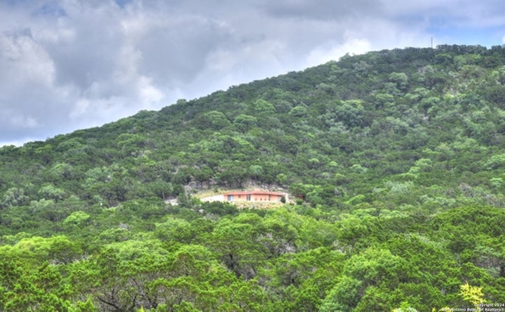 Photo 1 of 15 — 1523 SPRING RD, Pipe Creek, TX 78063