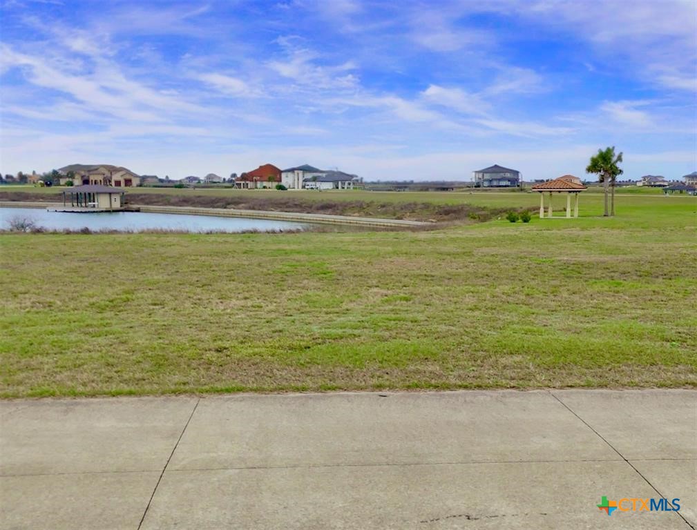 View of yard with a gazebo and a water view