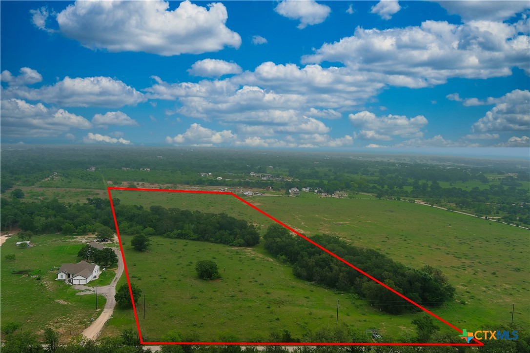 Drone shot from back of property towards the front