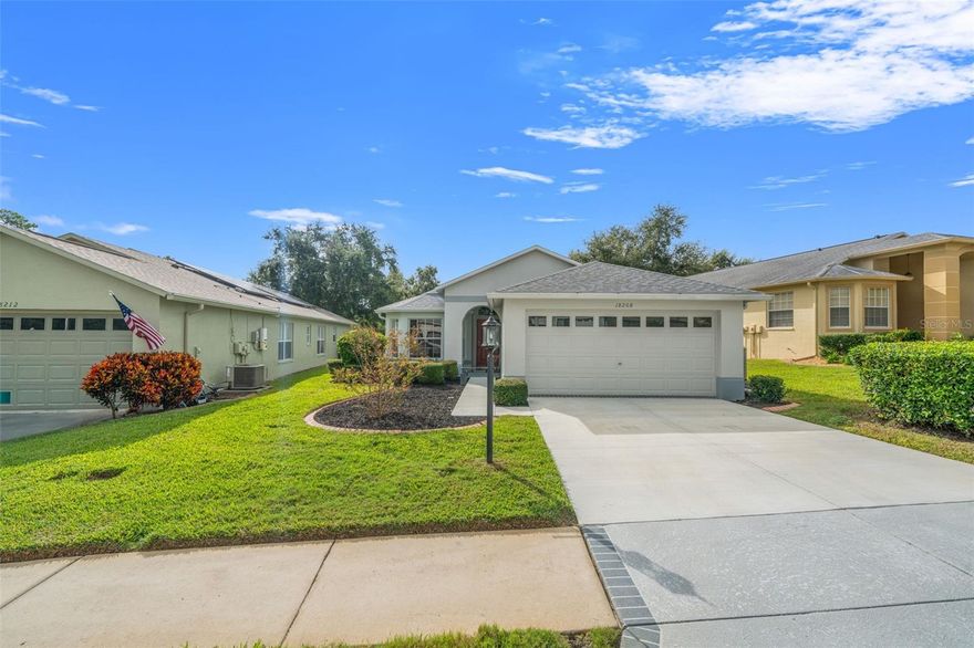 Welcome to 18208 Breland Drive, a beautifully maintained 3-bedroom, 2-bath home in the desirable Heritage Pines, a 55+ active adult community. This charming home offers a newer roof, fresh exterior paint, new driveway, and professionally landscaped yard that enhances its curb appeal.

Inside, enjoy a bright open floor plan featuring a spacious living, dining, and family room area—perfect for entertaining or relaxing. The kitchen includes a cozy breakfast nook, and the primary bedroom features two walk-in closets for ample storage. Additional highlights include no carpet throughout, elegant window shutters, and an attached 2-car garage.

Residents of Heritage Pines enjoy resort-style amenities, including a clubhouse, pool, golf, fitness center, and many social activities. Conveniently located near shopping, dining, and Gulf Coast beaches—this move-in-ready home offers the best of Florida retirement living!