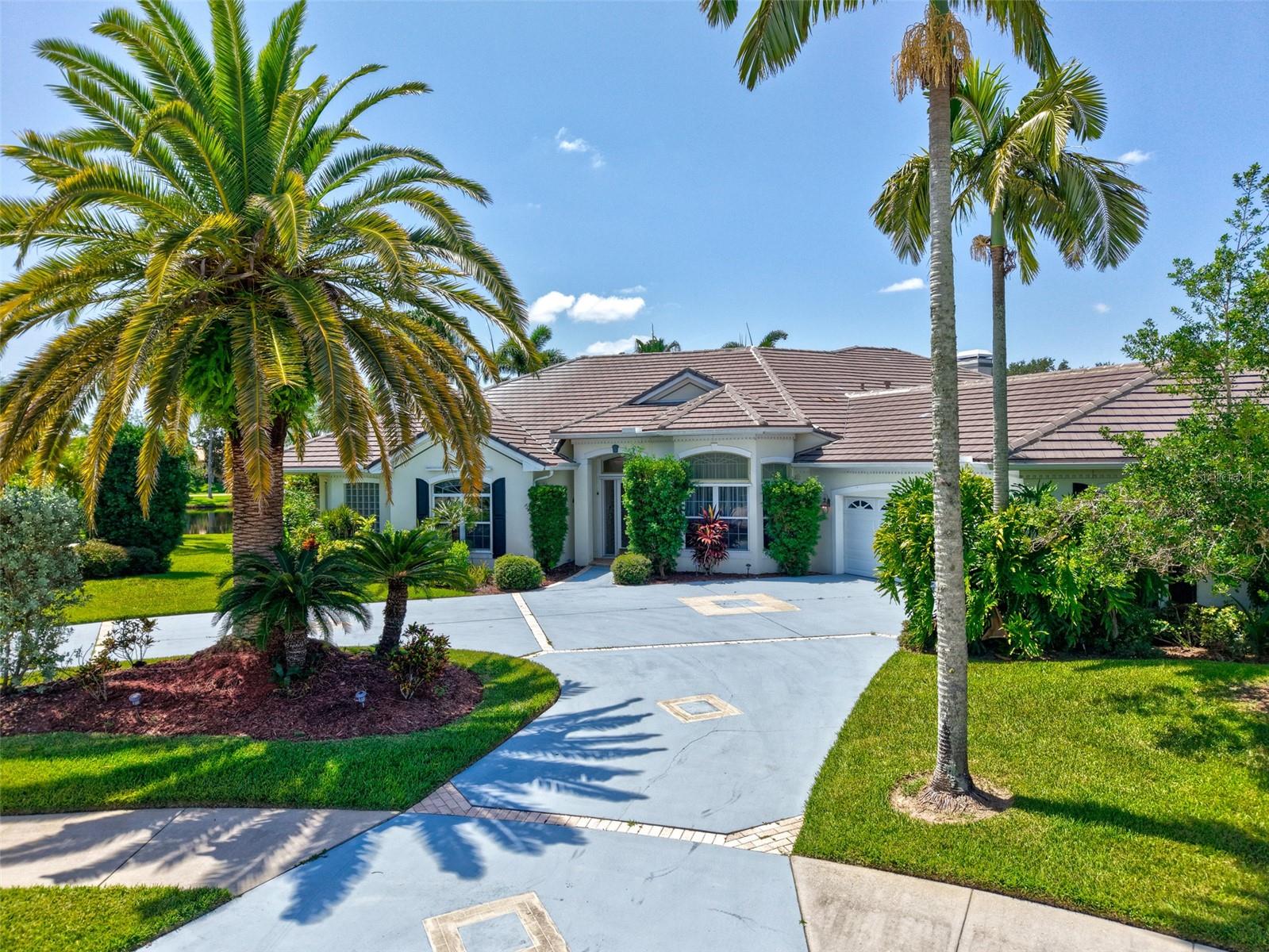 Stunning Lakefront Estate on Private Cul-de-Sac
This custom-built 5 bed, 4 bath home sits on a ½ acre lot with direct lake frontage. Features include a tile roof, lush landscaping, oversized 3-car garage, and circular driveway. Inside, enjoy 12-ft ceilings with triple crown molding and expansive views of the outdoor oasis.
The screened, heated pool and spa feature 4 waterfalls, plus a summer kitchen and covered patio perfect for entertaining. The formal dining room seats 14 with built-in cabinetry, while the spacious family room offers a fireplace, built-ins, and sliders to the pool.
The primary suite includes French doors to the pool, dual walk-in closets, and a jetted tub. All bedrooms are generously sized with large closets.
Luxury, privacy, and lakefront living this home has it all.