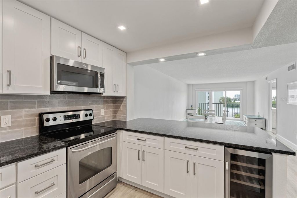 Photo of 51 Island Way #411, Clearwater Beach, FL 33767 (MLS # TB8453918)