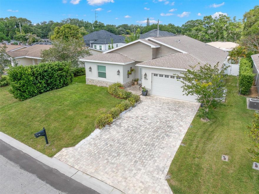 This beautifully finished (2020 build) 3-bedroom + study/4th bedroom, 3-bath residence combines contemporary design, thoughtful upgrades, and an exceptionally functional split-bedroom floor plan just minutes from Countryside, Dunedin, and Gulf beaches. 

A brick paver driveway, oversized 2-car garage, manicured landscaping, stacked stone accents, and a leaded glass entry door create impressive curb appeal from the moment you arrive.

Inside, the oversized foyer introduces the home, featuring extensive crown molding, oversized base trim, wainscoting, chair rail detailing, statement lighting, and wide-plank luxury vinyl flooring that extends throughout the main living areas. 10 FT high ceilings, 8 FT solid 3 panel doors, recessed lighting, oversized impact windows, and sliding glass doors enhance the bright open-concept design while creating seamless flow between the great room, dining area, and kitchen.

The spacious chef-inspired kitchen was designed to be both visually striking and highly functional, featuring bright shaker cabinetry with crown molding, designer quartz countertops, an oversized center island with seating with an additional under counter microwave and additional storage, upgraded stainless steel appliances, an integrated microwave, an undermount farmhouse sink, an elegant onyx marble backsplash, pendant lighting, and extensive cabinetry throughout.

The nearly 30-foot-long living area offers a generous gathering space beneath dual contemporary ceiling fans, while the adjacent dining area overlooks the covered rear patio and private fenced backyard.

Privately positioned, the oversized primary suite offers abundant natural light, luxury vinyl flooring, contemporary finishes, a spacious walk-in closet, and a stunning spa-inspired ensuite bath featuring dramatic marble-look tile, a frameless glass walk-in shower with rain shower head, freestanding soaking tub, designer quartz vanity, upgraded fixtures, and contemporary finishes throughout.

Additional bedrooms continue the home’s cohesive design aesthetic with luxury vinyl flooring, neutral finishes, contemporary ceiling fans, and beautifully updated baths with quartz vanities, upgraded fixtures, and designer tilework. The flexible fourth bedroom/study provides ideal space for a home office, fitness room, or guest accommodations.

Additional highlights include impact windows and sliding glass doors, oversized paneled interior doors, epoxy garage flooring, garage door exit to a side patio, pull-down attic access, rain gutters, an interior laundry room with built-in shelving, a 14 SEER Lennox A/C, 2020 commercial septic drip irrigation system, block construction, vinyl fencing, and an oversized covered rear patio designed for outdoor living and entertaining.

A huge bonus is the home's centralized location, less than 1 mile from Coachman Ridge Park, less than 2 miles from BayCare Ballpark, easy access to the Ream Wilson Clearwater Trail and Duke Energy Trail, and close to shopping, hospitals, beaches and more!