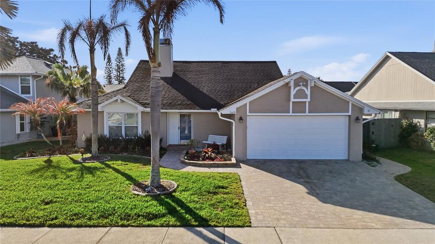 Welcome home to 563 W Springtree Way, a thoughtfully updated single story pool home located in Lakewood at the Crossings in the heart of Lake Mary, Florida, in Seminole County. Set on a quiet street, this residence blends quality renovations with comfortable everyday living across more than 1900 square feet of well designed living space. Many of the home's major updates have already been completed, creating a clean and cohesive feel throughout with much of the heavy lifting already done. From the curb, you are welcomed by a soft neutral exterior with a paver driveway and walkway leading to the powder blue front door and side gate, complemented by maintained landscaping and hardscape that wrap the property. Irrigation has been enhanced and a new fence lines the back property, creating both privacy and a polished outdoor setting. The screened lanai overlooks a sparkling pool that has been resurfaced and finished with new waterline tile, along with a new paver pool deck that creates a functional space for entertaining. Pool equipment has also been updated, including a saltwater generator replaced in 2023 and a pool pump motor replaced in 2022. Inside, the home has been significantly renovated. The kitchen was fully redesigned, offering a fresh and modern layout with updated cabinetry, counters, fixtures, appliances, and finishes that anchor the main living areas. A built-in beverage and wine cooler station with additional cabinetry was added just off the kitchen, creating a convenient space for entertaining and extra storage. The layout flows naturally into the dining and family spaces, creating an open atmosphere ideal for gathering and entertaining. The front living area is centered around a beautifully refreshed fireplace featuring updated brick and a redesigned mantel, creating a warm focal point within the room. Privately positioned away from the secondary bedrooms, the primary bedroom serves as a quiet and comfortable escape from the main living areas. Generous in size and filled with natural light, the space is elevated by vaulted ceilings and a neutral design. The en suite bath has been completely remodeled with updated cabinetry, granite counters, modern fixtures, and refined finishes, along with a spacious walk in closet enhanced with custom built-ins for ample storage and organization. The secondary bedrooms are nicely positioned for privacy and share a full bath, offering flexibility for guests and family. The backyard features updated turf and a mini putting green beside the lanai, creating the perfect place to relax or host friends while enjoying Lake Mary evenings. Everything has been carefully maintained, adding to the pride of ownership that is evident throughout the property. With extensive interior renovations and meaningful exterior upgrades already addressed for the new homeowner, including an air conditioning system installed in 2022, a water heater replaced in 2023, and garage floor surfacing, this home presents a rare opportunity to own a move in ready property where the work has already been done. Located close to shopping, dining, and top rated Seminole County schools in Lake Mary, with convenient access to major roads including I-4 and 417, and near Sanford International Airport and Historic Downtown Lake Mary, 563 W Springtree Way is ready for its next chapter.