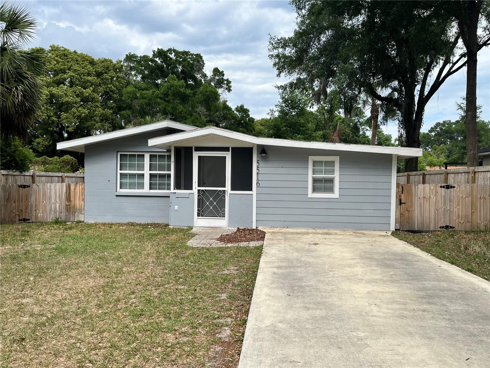 What a great place to call home. Conveniently located in Zephyrhills city limits and walking distance to downtown. The property features front and rear entry access. The backyard is fully privacy fenced with a large double-gate to allow vehicle entry. The home was recently remodeled with features including 12x24 tile in the entire home, newer kitchen and bathroom cabinets, hardware, granite counters, sinks, toilets and more. The Kitchen features a bar, stainless steel appliances and more. Both bedrooms and bathrooms are spacious. Each bathroom has dual sinks. Laundry room and newer AC. The backyard is very spacious for whatever you desire. No HOA. Also the roof was just replaced in June of 2025. Hurry, this one is nice!!