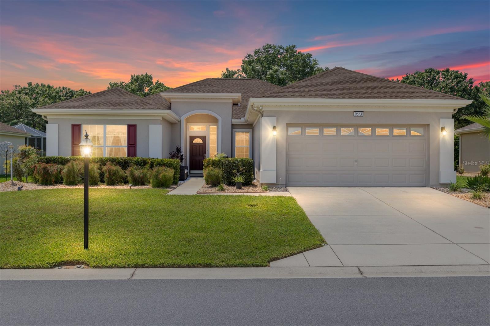 There are Madeira homes… and then there are SPECIAL Madeira homes. This is one of the special ones! ?
As you arrive, you’ll notice the spotless driveway and walkway leading to a welcoming front patio seating area. Step inside and you’ll be impressed with the attention to detail throughout — crown molding, 5-inch baseboards, and ceramic tile flooring flow seamlessly through the home. The tiled lanai, complete with crown molding, newer single-pane glass windows, and a finished ceiling, feels like an extension of the living space. A clever Murphy-style bed offers extra sleeping accommodations for guests without sacrificing room. All lighting has been upgraded to energy-efficient LED. The kitchen was updated in 2021 with crisp white cabinets, brushed nickel hardware, and newer stainless-steel appliances. Both bathrooms have been refreshed with granite-topped vanities and raised-height counters, while the primary bath boasts a newer shower.
Additional updates include:
• New roof (2024)
• HVAC (2019)
• Hot water heater (2019)
• Exterior paint (2021) and interior paint (2020)
• Insulation added over lanai and garage ceilings, plus insulated garage door
• 6-inch gutters with underground drainage
This home is truly move-in ready with upgrades already done for you. Don’t miss your chance to see one of the finest Madeira models available!