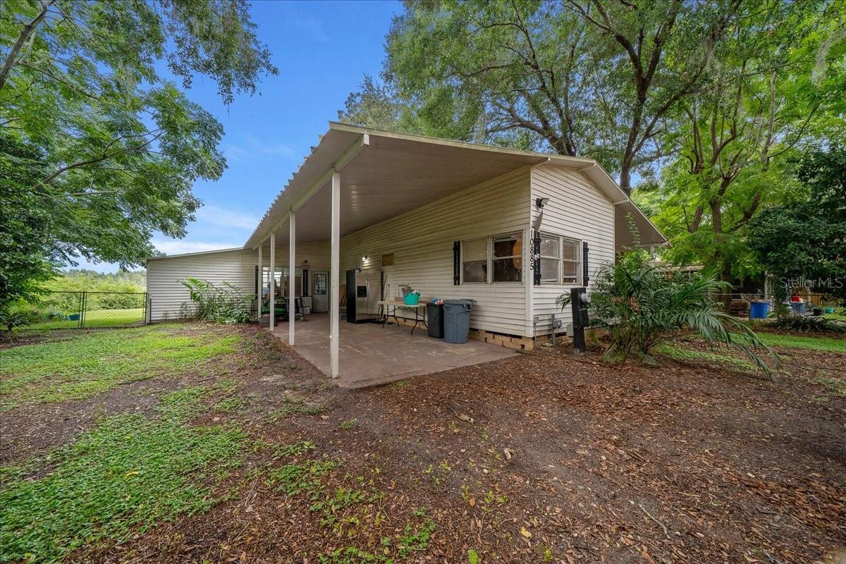 Charming and full of potential, this 2-bedroom, 1-bathroom home offers 936 square feet of comfortable living on a spacious 0.27-acre lot in a peaceful Summerfield neighborhood. Built in 1972, the home features with upgraded flooring throughout, a functional layout, and an in-unit washer and dryer for added convenience. The property sits on a generous lot with beautiful water views, providing a serene outdoor setting with plenty of space for gardening, entertaining, or future additions. The exterior is constructed with durable metal siding on a pier foundation, and the home is equipped with electric heating and cooling for year-round comfort. With no HOA restrictions, you’ll have the freedom to make this property your own. Located just minutes from Lake Weir, The Villages, shopping, dining, and local schools, this home is a great fit for first-time buyers, downsizers, or investors looking for a smart opportunity in Marion County.