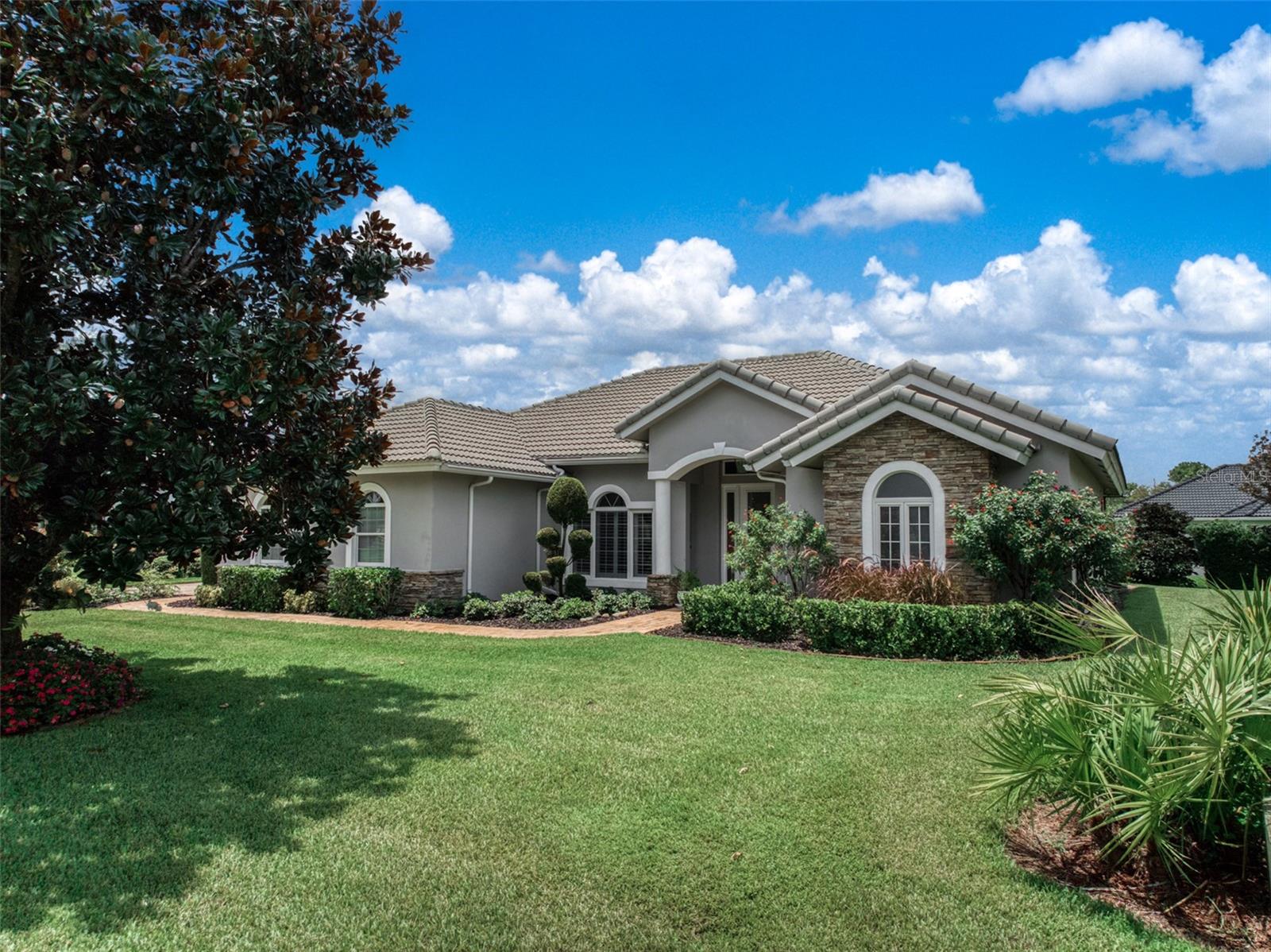 In the sought-after Magnolia Place community of Sun N’ Lakes, this home blends timeless style with everyday comfort—
and it starts from the top with a 2023 concrete barrel tile roof, a major upgrade built for beauty and durability. Inside, the
open split-bedroom floor plan is filled with light and features 12-foot vaulted ceilings, 8-foot doors, and a host of custom
details—tray ceilings, angled ceramic tile floors, crown molding with accent lighting, 5-inch baseboards, rounded corners,
and upgraded remote-control ceiling fans. The kitchen offers solid wood cabinets, granite counters, under-cabinet lighting,
recessed lights, and stainless-steel appliances less than four years old. A built-in dry bar in the dining area serves as a
coffee nook or cocktail station. The primary suite is a peaceful retreat with two walk-in closets and a spa-inspired bath
boasting dual sinks, a walk-in shower, private water closet, and linen closet. Two guest bedrooms, including one with a
built-in desk, share a full bath with a glass-enclosed tub/shower combo. Step outside through hurricane-rated sliding
doors to a screened porch with paver flooring—perfect for enjoying Florida’s year-round weather. The property runs on city
water and sewer, features well irrigation, and has a professionally maintained lawn with regular fertilization and pest
control. Living here means access to a community pool, clubhouse with restaurant, two premier golf courses (Deer Run &
Turtle Run), plus on-site police and fire services. All of this just minutes from Advent Hospital, shopping, dining, and more.