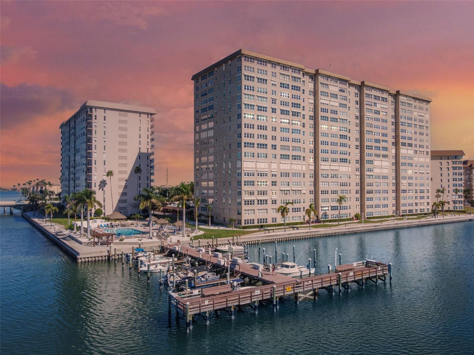 RARE OPPORTUNITY to own this fabulous spacious corner unit, 2 bedroom 2 bath, 55+ WATER-FRONT luxury living. BREATHTAKING GULF of AMERICA VIEWS and SUNSETS from just about entire home. THIS UNIT IS BEING OFFERED FULLY FURNISHED. As an INCOME PROPERTY, it has been a consistant profit generator. This home offers a spacious living area throughout, perfect for entertaining, Kitchen beautifully spills over to living area creating a gorgeous experience. ABUNDANCE of closets throughout home, Master bedroom has a California style WALK-IN CLOSET and granite vanity, and best of all.. OPEN WATER VIEWS FROM MASTER BEDROOM. The Exxex house has its own building gym on the first floor along with, party room, storage room, ( for bikes, kayaks ect,) a LARGE HEATED POOL, Tiki hut, plenty of lounging areas, Shuffle board, fishing pier, cleaning station, kayak launch area, The community as a whole has FOUR HEATED POOLS, club house, fitness center, tennis courts, kayak station, boat docks, fishing piers and gorgeous walking paths throughout property. THE BEST PART.... Location to St. Pete Beach and all the entertainment it has to offer from hotels, resturants, pubs, comedy clubs, emergency care, water front dining, A ten minute uber and youre down town Saint Petersburg with its private airport, yacht club, upscale dining, night life, clubs, hospitals, shopping, all forms of entertainment available to include museums, sports areans for soccer, baseball. EASY ACCESS to Rt, 275 N and Tampa international airport just 20 minutes away. Whether this is to be a second home, income property of primary residence... This property seriously has everything one could need at this amazing price offer. COME SEE.