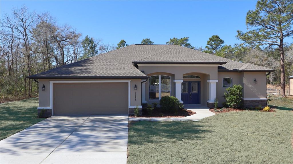 Photo of 12085 Harris Hawk Road, Brooksville, FL 34614 (MLS # TB8469311)