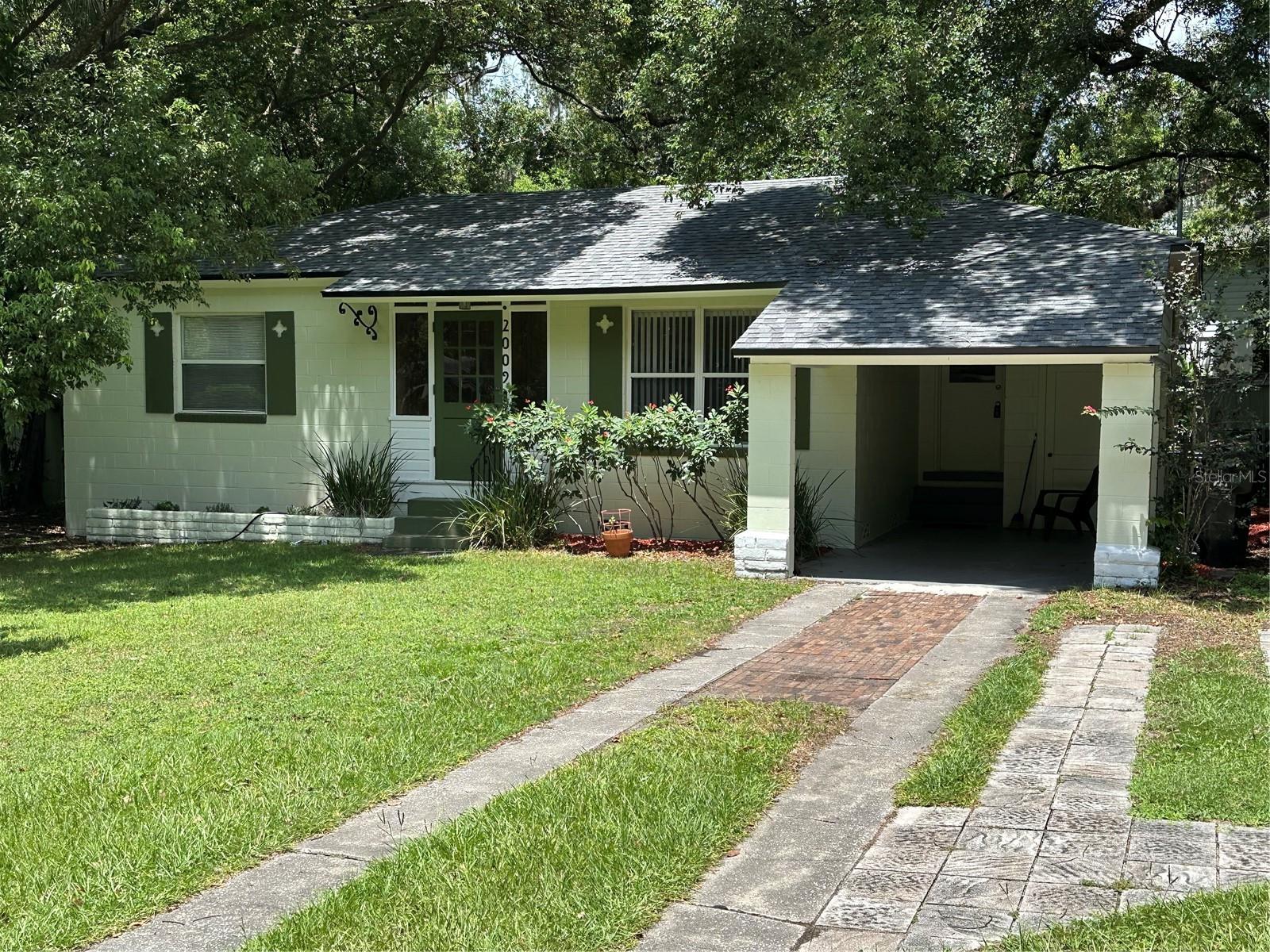 This 1950 Bungalow home offers urban living in convenient neighborhood. Great location provides easy access to Downtown, Thornton Park, Milk & Hour-Glass Districts, shopping, restaurants, nightlife, Kia Center, MLS Soccer, Dr Philips Performing Arts Center. Azalea Park and Carl T Langford Park are just around the corner on Central Blvd. Featuring 2 bedrooms, 1 + half bathrooms, hardwood floors, efficient built-in storage both bedrooms, interior laundry with full size washer/dryer, French doors into Florida room with view of spacious fenced rear yard has storage shed and plenty of space for vegetable garden. 200 Amp electric panel 2007, additional 1/2 bath new in 2021, new roof 2023, new HVAC-heat pump 2023, exterior painted 2025. Easy access to I4, 408, 417 makes commuting anywhere in Orlando area a breeze.