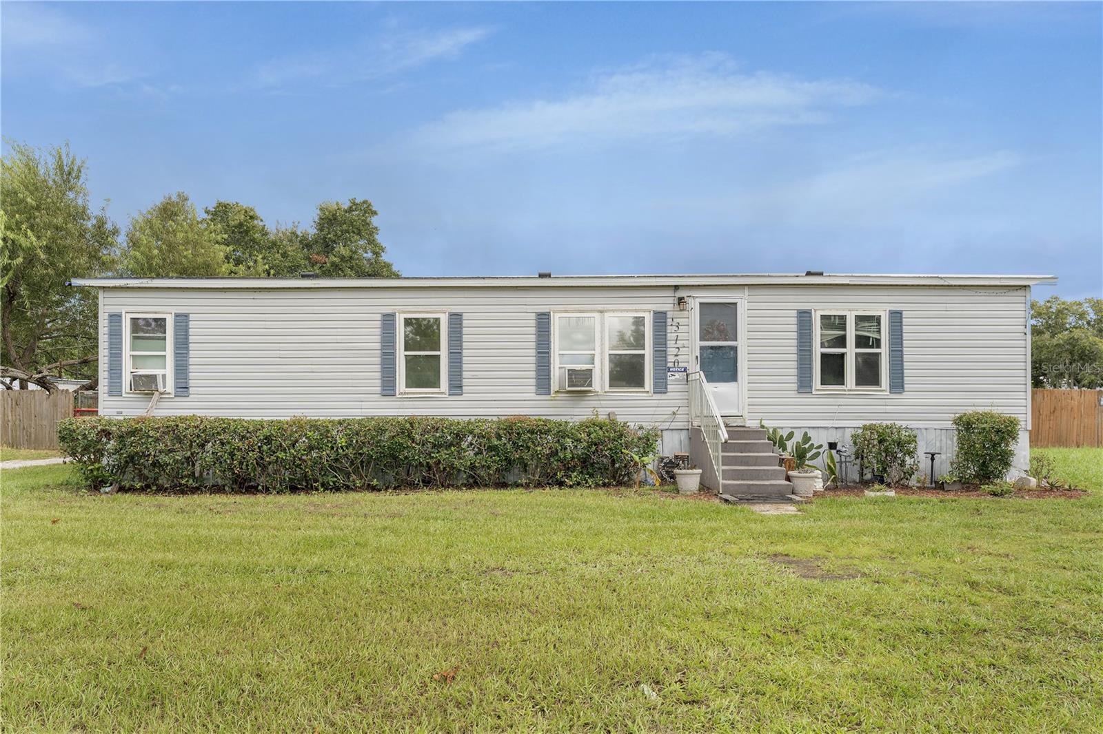 Discover 3120 Holly Hill Cut Off Rd in the heart of Davenport!
Opportunities like this don’t come around often — a home on over an acre of fully fenced land right in the peak area of Davenport, just minutes from I-4 and the shops, dining, and entertainment of Posner Park. Large lots like this are hard to find in this part of town, making it a true gem for anyone who values space, privacy, and convenience!
Inside, the home has been refreshed with an updated kitchen, modernized bathrooms, and rich hardwood floors that add warmth and character. Step outside and you’ll find an oversized 4-car garage/workshop in the back on a concrete slab foundation — ideal for car lovers, storage, or projects of all kinds. BRING THE TOYS!
Whether you’re dreaming of extra land for outdoor living, a hobby space, or simply a rare slice of privacy close to everything, this property delivers it all.