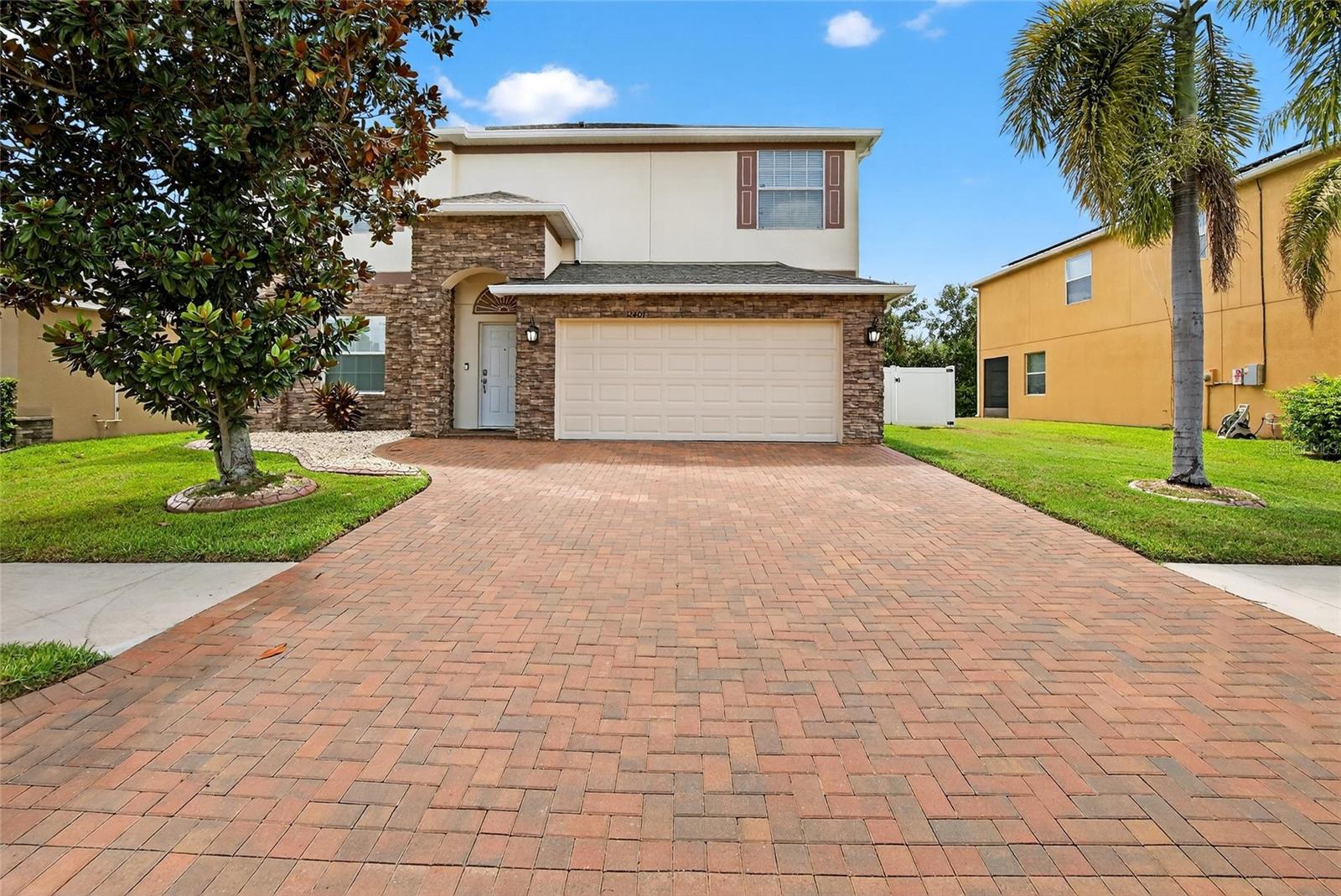 Welcome to your dream home in the highly sought-after Panther Trace community in Riverview, FL!
This stunning two-story single-family residence offers 2,502 square feet of beautifully updated living space, featuring 4 spacious bedrooms, 2.5 baths, and a 2-car garage with custom cabinetry. Step inside to find gorgeous flooring throughout, a modernized kitchen with solid cabinetry, granite countertops, an expanded island, and a designer backsplash, along with fully upgraded marble bathrooms. Upstairs, all bedrooms are conveniently located, including the luxurious primary suite with a walk-in closet (featuring a built-in organizer) and a spa-like en-suite bath with dual sinks, walk-in shower, and soaking tub. The backyard is a private retreat designed for both relaxation and entertaining. Enjoy the sparkling pool with dual water features, LED lighting, and a screened enclosure with an additional 8 LED lights. The backyard also boasts a stone-accented outdoor kitchen (just add your grill), shellock paver deck, fruit trees and vinyl/metal fencing for added privacy. This home has been meticulously maintained and updated for peace of mind: New roof (2025) Pool with LED lights & screened enclosure (2020) Backyard shellock pavers (2020) Outdoor kitchen with granite top (2023) Driveway pavers & stone-accented exterior (2023) Fully upgraded bathrooms with marble finishes (2023) Expanded kitchen island & tile flooring (2023) Custom closets in garage & bedrooms (2018)
New washer (2024) & water softener (2025) Community Amenities: Panther Trace offers resort-style living with a lagoon pool, splash park, clubhouse, playgrounds, tennis and basketball courts, walking trails, and an onsite elementary school. Conveniently located just minutes from I-75 and Hwy 301, you’ll be within easy reach of Downtown Tampa (15 miles), Busch Gardens (18 miles), The Florida Aquarium (15 miles), Brandon Town Center (10 miles), and the sandy shores of Apollo Beach (20 miles). With its blend of luxury updates, community amenities, and unbeatable location, this home is move-in ready and waiting for its next owner!