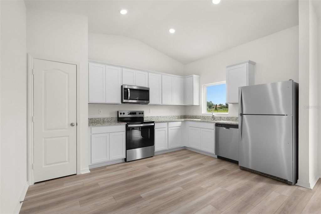 Photo of 13323 Tula Loop, Astatula, FL 34705 (MLS # TB8491001)