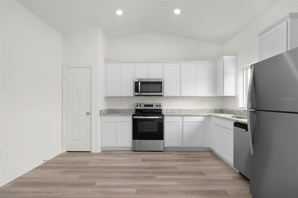 Photo of 13323 Tula Loop, Astatula, FL 34705 (MLS # TB8491001)