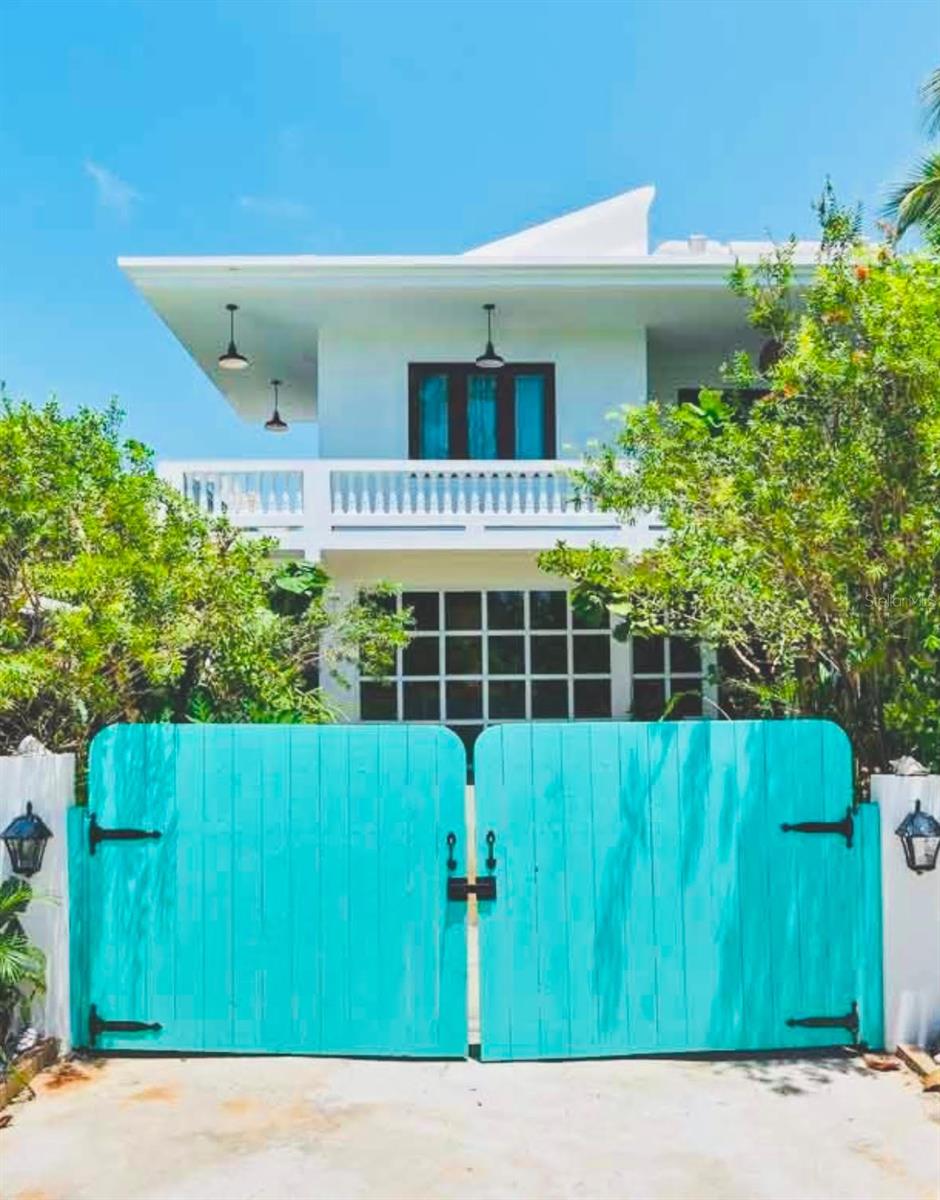 Come Home to Paradise!! Located just 2 minutes walking to beach and nestled between Jobos and Shacks Beach lies this mint turnkey completely furnished and equipped villa. Its meticulous bohemian design melds perfectly with the Zen feeling of this delightful and luxurious home. Enjoy this property as a single family home or use as a two family residences. The newly finished first level of the home with wrap around terrace, has an open style layout with hardwood floors, open style kitchen with hand crafted wood counter tops, modern kitchen with open style shelving that spills out into the spacious family room, study, and dining area. An expansive first floor master bedroom, leads to a back terrace to enjoy coffee in the gardens and is rounded out with a large walk in closet, laundry and full bath with shower. The second level of the property also with wrap around terrace, has beautifully designed tiles, vaulted ceilings leading into the ample open style kitchen with wood tops and farm style sink, leading out to the dining room. This level is complete with 4 bedrooms, 2 full baths, back terrace, and laundry room. The owners spared no expense with GE Café design appliances, newly renovated kitchen and hardwood floors, 24 Solar Panels, 2 10k Tesla Batteries, 600 g water cistern, hurricane grade windows, wireless cameras, water sports storage, heated outdoor detached yoga studio, fully furnished, fire pit, jacuzzi and lush gardens all adding to your own private oasis. Short Term Rental Permitted. No HOA.