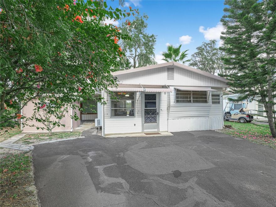 Grab your two tickets to paradise and come on down to Saddlebag Lake Resort, in sunny Central Florida, where you'll live every day like you're on vacation!  This is a fun loving, 55+ community where you OWN the land.  This 1/1 winter retreat comes fully furnished and ready to move right in.  The first floor has a combination living and dining room, plus a secluded family room at the back. Upstairs you'll find a breakfast nook, a spacious kitchen with plenty of counter space, a bathroom with tub and shower, plus a restful bedroom.  Outside there's a large covered patio, perfect for outdoor entertaining, and the workshop includes a washer and dryer hook-up.  There's an orange grove at the back of the home, so you'll have no rear neighbors.  The resort is pet friendly, so even your furry family members will feel welcome here, and they'll love the dog park at the back of the community, there's even a dog wash station so you can bring them home fresh and clean.  You'll love the sparkling pool, and the screen-enclosed hot tub.  You can be as active as you want to be here, with pickle ball and tennis courts, shuffleboard courts, horse shoes, access to the lake for fishing and boating, a fitness center, a driving range to practice your swing, and a rec rooom with pool tables and saunas.  There's even a lakeside beach house complete with a kitchen and covered patio that you can use for events free of charge, just reserve it.  Get to know your neighbors by joining the club of your choice, or participate in planned activities at the clubhouse. You won't even have to leave the resort to get your mail, there's a post office onsite.  All of this is included in the low quarterly HOA dues, as is your water, sewer and trash pick-up. You owe it to yourself to check this out before it's gone, call now to schedule your private tour!