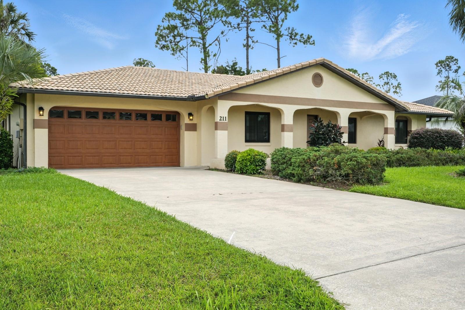 POOL HOME! Welcome to 211 Beachway Drive! Nestled in a serene neighborhood, this 3-bedroom, 2-bathroom home offers 1,675 square feet of living space. Step inside to high ceilings and newer windows. The kitchen features solid wood soft-close cabinets and granite countertops throughout. Relax or entertain in your private, screened-in pool area, surrounded by lush, meticulously maintained landscaping and vibrant shrubbery, creating a peaceful retreat right in your own backyard. Whether you're enjoying a quiet morning by the pool or hosting friends, this home is designed to make every moment special. A brand new architectural shingle roof is in progress and will be installed before closing. 2025 water heater. 2021 AC. 2019 Windows.