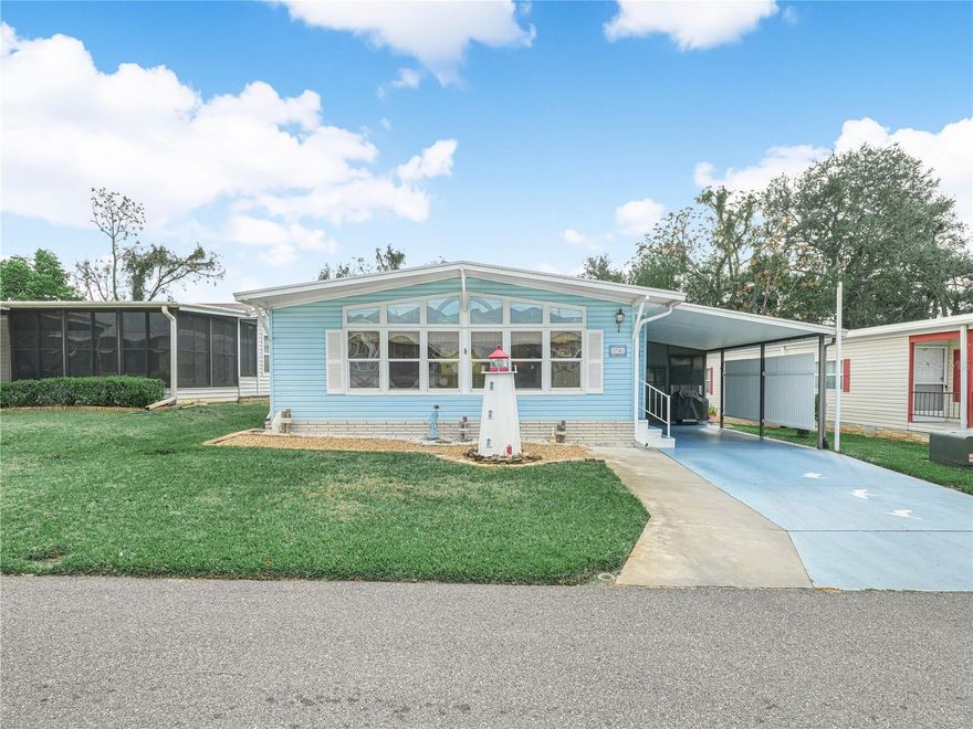 This charming home is situated in the highly sought-after 55 and older community of Foxwood Lake Estates. The community offers heated pool and hot tub, Club House with billiard room, fitness center, shuffle board, pickleball, and lake for fishing.  As you step inside, you are greeted by an abundance of natural light streaming in through the wall-to-wall windows in the Florida Room, creating a warm and inviting atmosphere. The spacious living room seamlessly flows into the dining room and kitchen, making it perfect for entertaining guests. The dining room boasts a built-in china cabinet, adding a touch of elegance to the space. The kitchen comes fully equipped with all appliances, ensuring convenience for everyday living. Recent updates include a new roof in 2024 (warranty), A/C unit in 2023 (warranty), plumbing replaced with PEX, and newer double-paned windows, providing peace of mind for the future. The main bedroom features an ensuite bathroom with a walk-in shower and a walk-in closet, offering a private retreat within the home. The second bedroom shares a second bathroom, providing comfort and convenience for guests or family members. Outside, the 12’x23’ carport offers ample space for outdoor living, complete with a screened area for relaxation. Additionally, the 12x15 utility room includes a washer and dryer, as well as a workshop and extra storage space, catering to all your practical needs. The chain-link backyard is ready for your gardening endeavors, allowing you to create your own outdoor oasis. Don't miss out on this wonderful opportunity - call now for more details and make this lovely home yours today.