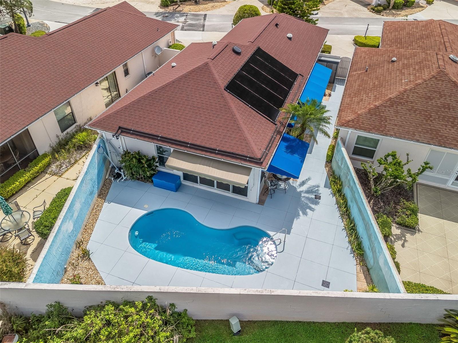 *DREAM POOL HOME in the Village of Rio Grande, Villa De La Mesa South!* Stunningly UPGRADED! 2-bedroom, 2-bathroom villa *BOND PAID*!! *NEW ROOF (2024)* Perfect home to start enjoying the Florida lifestyle! VIEW THE POOL FROM THE KITCHEN, DINING, LIVING & MSTR BEDROOM! UPGRADES include: High-end * GORGEOUS TILE PLANK flooring & 6" BASEBOARDS throughout! NO FLOOR TRANSITIONS! It's NEUTRAL painted & has a BRIGHT & airy atmosphere enhanced by **PLANTATION SHUTTERS** and 3 **night-lit SOLAR TUBES!!**. Step outside to your very own **PRIVATE COURTYARD & POOL!!**, where you can bask in the sun or unwind in the evening. The *west-facing courtyard* features a beautifully resurfaced SOLAR HEATED POOL (2024), FRESH EPOXY Painted Decking (JULY2025) large OUTDOOR AWNINGS, a Beautiful CUSTOM PAINTED WALL, and low-maintenance landscaping- NO GRASS—say goodbye to mowing the lawn! The heart of the home, the kitchen, showcases slow-close **KRAFTMAID cabinets**w/pull-outs, sleek **QUARTZ countertops**, and **INSIDE LAUNDRY** facilities. This villa has two thoughtfully UPDATED BATHROOMS, and is packed w/ ADDITIONAL UPGRADES including a *new exterior paint (2023)*, a *solar attic fan*, reflective window tinting, and upgraded glass doors that replace traditional sliders, *upgraded ceiling fans*, and a modern day MURPHY BED!(smart feature that conveniently transforms the 2nd bedroom space effortlessly to accommodate guests!) You'll love the OVERSIZED *1.5-car garage* w/ ELECTRIC SCREEN DOOR & attic stairs for EXTRA STORAGE. The ENCLOSED LANAI w/ comfortable VIEWs of the pool, provides a perfect spot for year-round enjoyment! Just a quick walk, you can access the **De La Mesa PRIVATE COMMUNITY PARK** complete with a walking trail and pool. Located just over A MILE, a short few minutes BY GOLF CART, TO SPANISH SPRINGS TOWN SQUARE!!(2-1/2 mi to LAKE SUMTER LANDING!) NEAR SHOPPING, MEDICAL, RECREATION AND RESTAURANTS!! Don’t miss your chance to own this exquisite villa that perfectly captures the essence of Florida living. Schedule your private showing today and experience the beauty of this exceptional home!