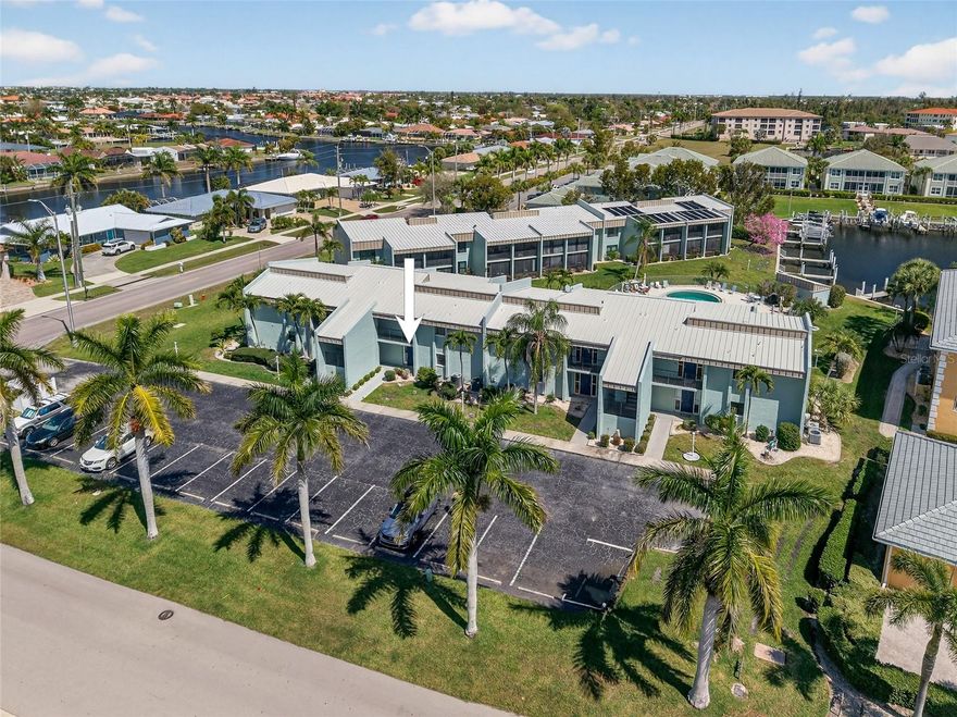 RARE OPPORTUNITY IN PUNTA GORDA ISLES! TURNKEY AND MOVE-IN-READY! First-floor 2 bedroom, 2 bath waterfront condo just minutes to City Nature Park and minutes to downtown Punta Gorda with easy biking access to restaurants, Harborwalk, and everything the area has to enjoy. Enjoy the boating lifestyle with community boat slips available first-come, first-serve and approximately 30-minute sailboat access to open water, with great cruising and fishing along the way. Bright open living and dining area with beautiful bamboo flooring flows to a screened lanai with pool and canal views. Split floor plan provides privacy for you and your guests and east-west exposure to enjoy amazing sunrises and sunsets. Hurricane shutters for storm protection and peace of mind. Community pool, brand new A/C (2026), newer water heater and assigned parking space. Don’t miss this opportunity to make this property your new snowbird retreat or permanent home. Enjoy the Punta Gorda Isles lifestyle at an exceptional value! Schedule your private showing today.
